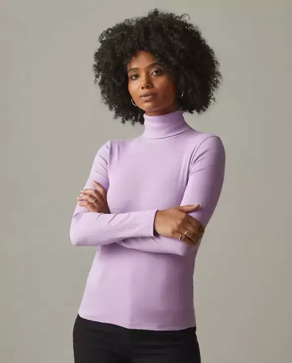 Woman wearing a pink turtleneck by American Giant