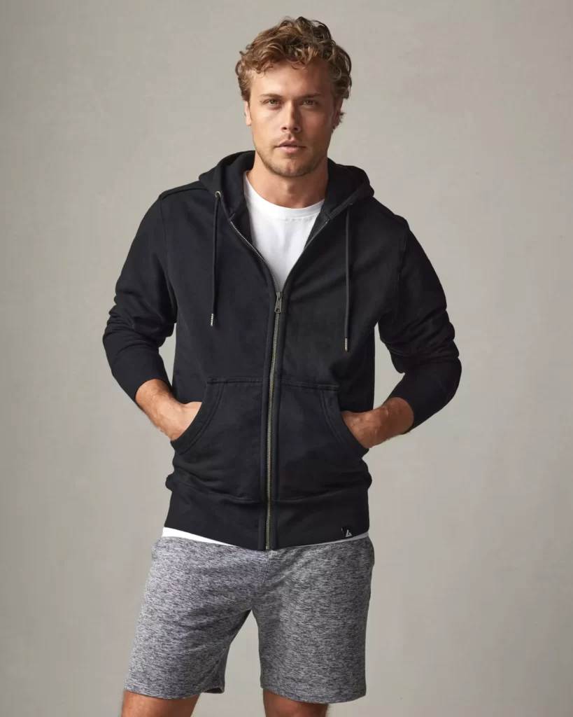 Man wearing a black hoodie by American Giant
