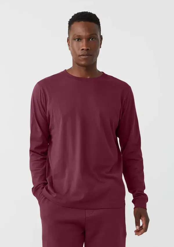 Man wearing burgundy made in the usa long sleeved tee