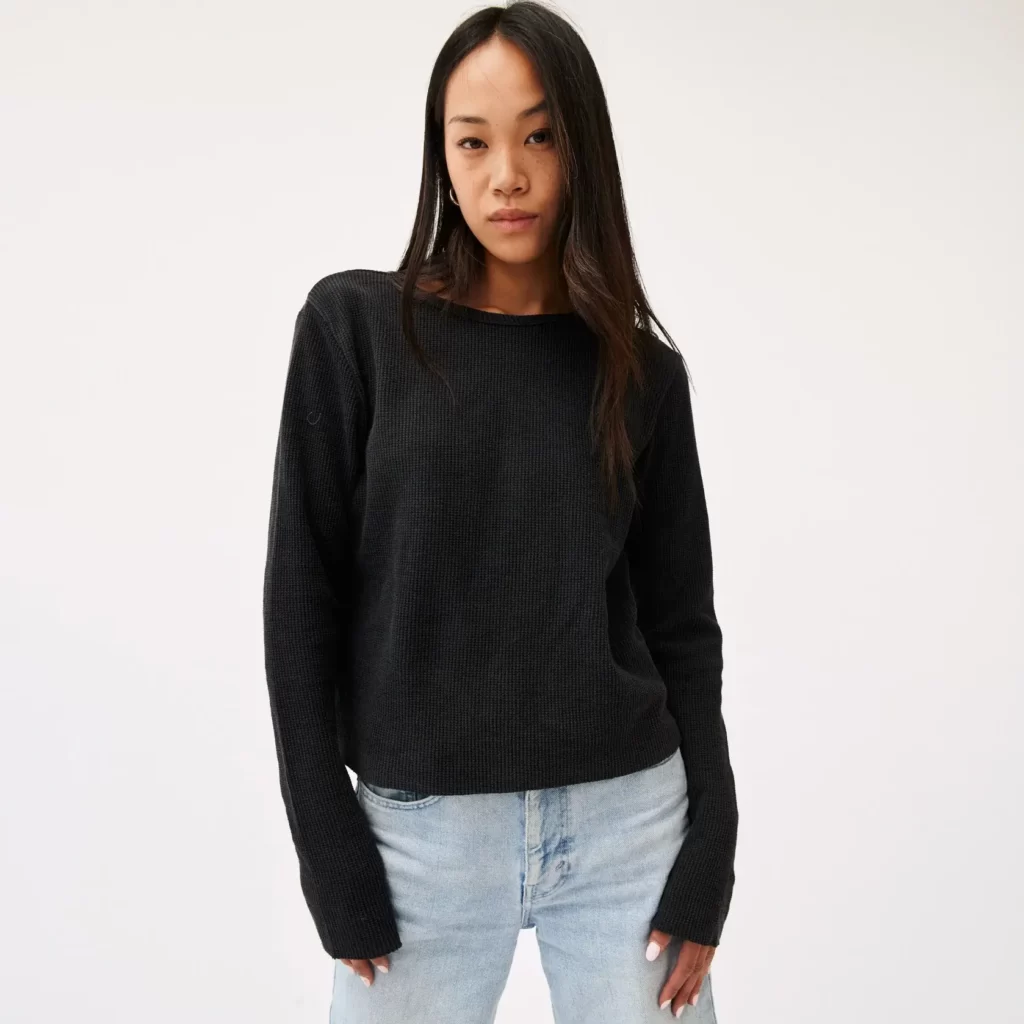 Woman wearing a dark made in the USA sweater