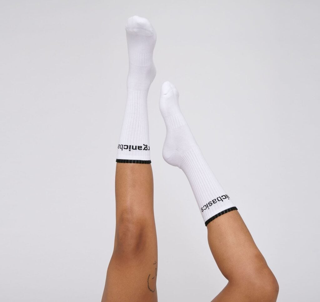 Organic Basics organic cotton socks in white, ribbed with black stripe and organic basics printed 
